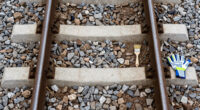 Painting The Sides Of Railroad Rails White To Reduce Derailment